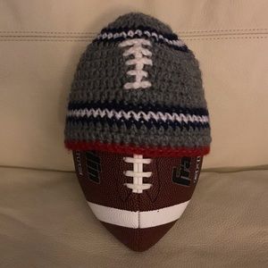 Homemade small child’s football knitted hat